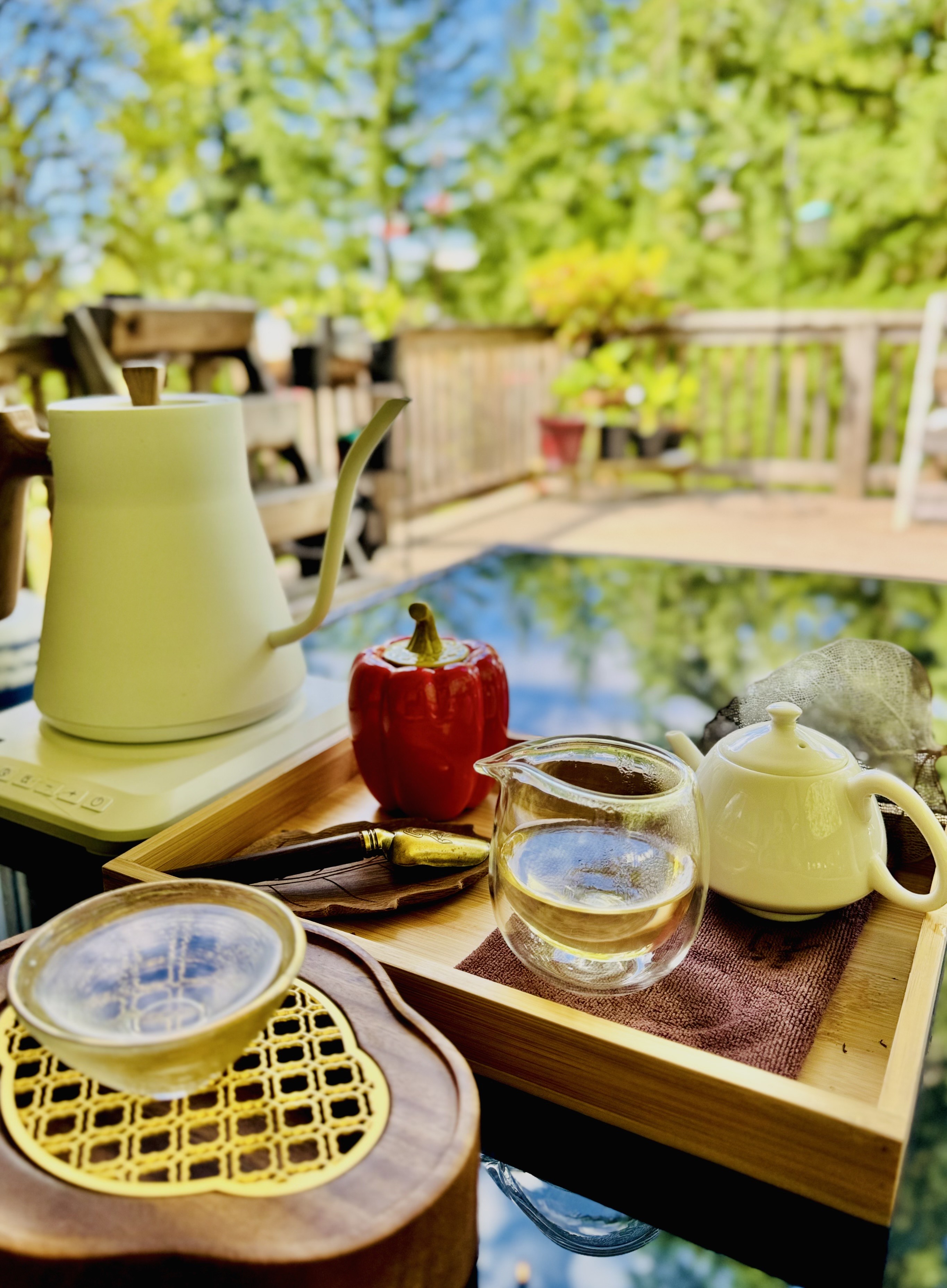 Teapot pouring tea into a cup